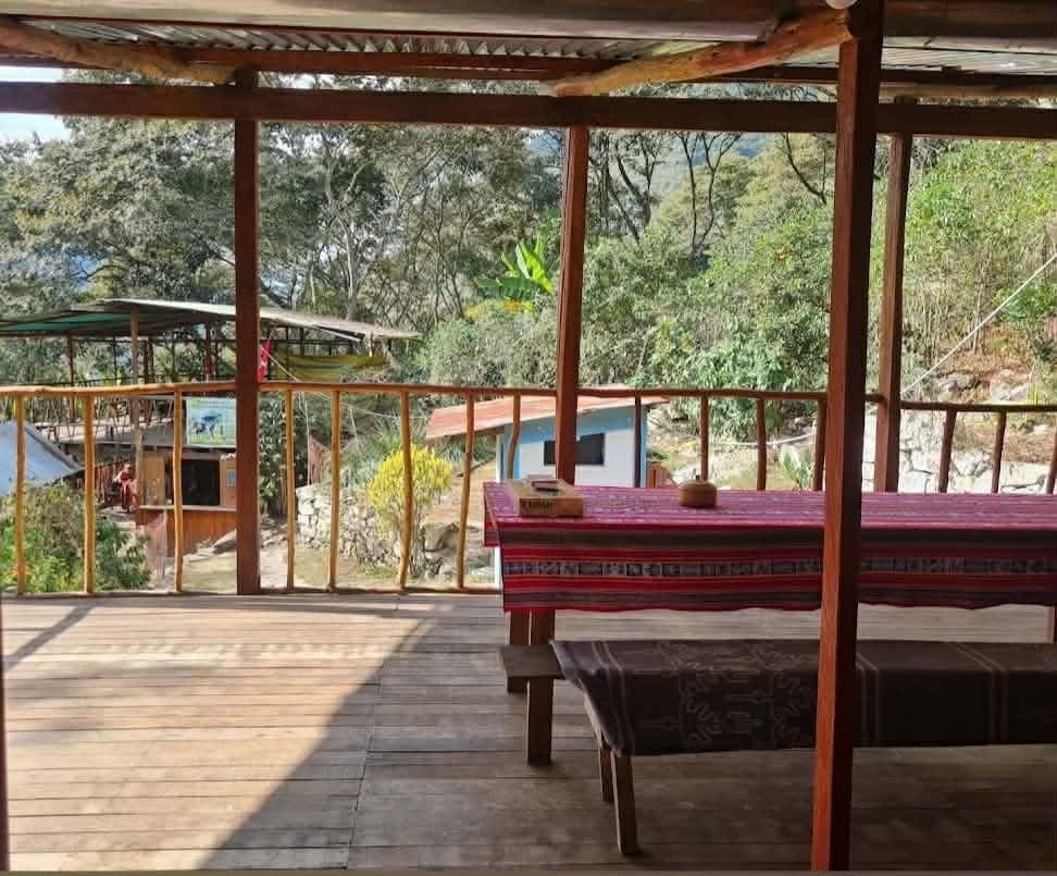 Terrace and common spaces at Refugio de Mery in Lucmabamba