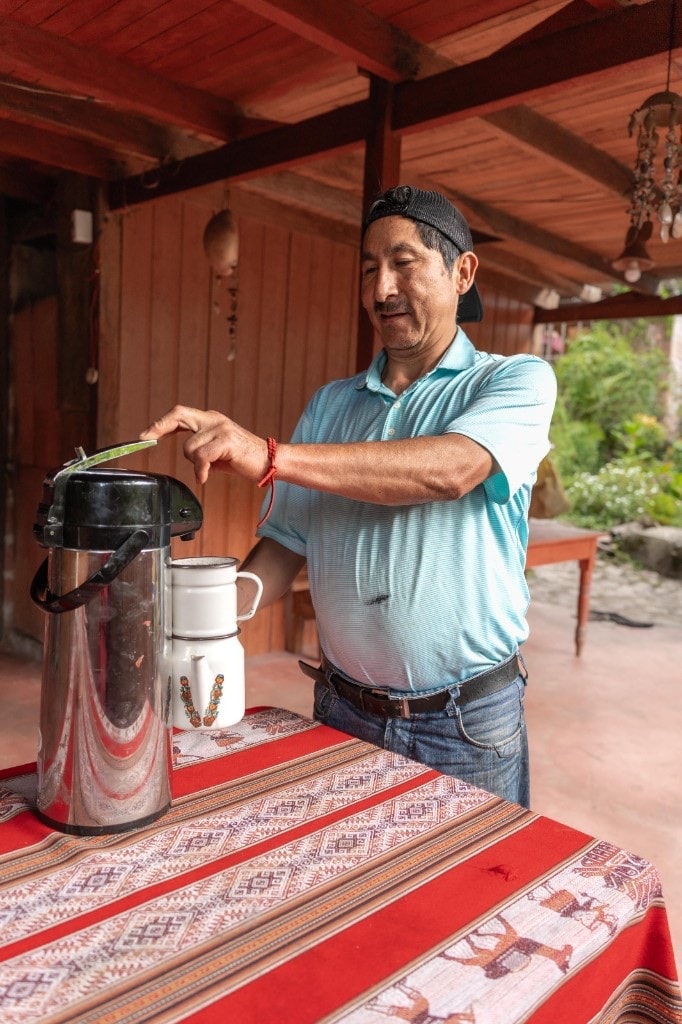 Pouring fresh farm coffee at the lodge table
